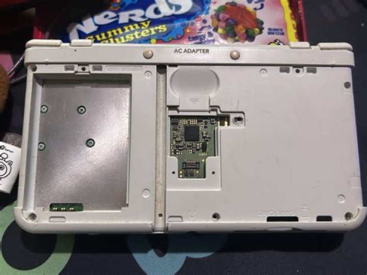 where is the sd card on the new 3ds xl? here is the answer